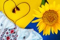 Ukrainian national colors, sunflower against embroidered cloth