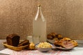 Ukrainian national drink and snack. The big bottle and glass of moonshine on the old wooden table. Russian vodka and snack. Royalty Free Stock Photo