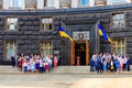 Ukrainian officials and ministers near the Building of Cabinet of Ministers during celebration of Day of State Flag of Ukraine in