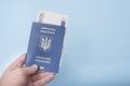 Ukrainian passport and euro cash in the man`s hand. Travel conce Royalty Free Stock Photo