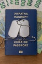 Ukrainian passport, soldier identification badge, euro banknotes. Concept: corruption in Ukraine, evasion of mobilization