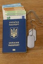 Ukrainian passport, soldier identification badge, euro banknotes. Concept: corruption in Ukraine, evasion of mobilization