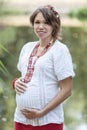 Ukrainian pregnant woman in traditional embroidered shirt Royalty Free Stock Photo