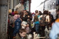 Ukrainian refugees from Mariupol on Lviv railway station waiting for train to escape to Europe Royalty Free Stock Photo