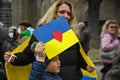 Ukrainian refugees participate in the European public protest against the Russian military invasion