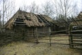 Ukrainian wooden rural barn and cattle yard of 17 century stylized half ruined, reconstruction. Kyiv, Ukraine