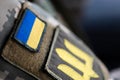 Ukrainian soldier. Flag, coat of arms trident on a military uniform. Armed Forces of Ukraine. AFU