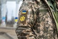 Ukrainian soldier. Flag, coat of arms trident on a military uniform. Armed Forces of Ukraine. AFU