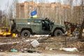 Ukrainian soldier near armored car at Hostomel airfield