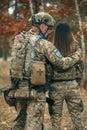 Ukrainian soldiers man and woman dressed military uniform. Couple in love at war. Russian military invasion of Ukraine