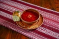 Ukrainian traditional borsch. Russian vegetarian red soup in a ceramic bowl on rustic wooden table background Royalty Free Stock Photo