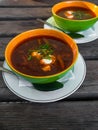 Ukrainian traditional borsch. Russian vegetarian red soup in white bowl on wooden background. Top view. Royalty Free Stock Photo