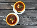 Ukrainian traditional borsch. Russian vegetarian red soup in white bowl on wooden background. Top view. Royalty Free Stock Photo