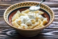 Ukrainian traditional lazy dumplings with cottage cheese. Ukrainian Cuisine. Homemade vareniki in a bowl, delicious lunch.