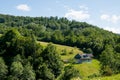 Rural house on a green hill Royalty Free Stock Photo