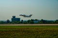 Ukrainian twin-engine jet passenger plane An-148 takes off from concrete runway. Airplane over runway. Landing gear released. Royalty Free Stock Photo