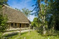 Ukrainian village rural landmark view wooden house porch exterior surrounded by garden trees green foliage in spring time Royalty Free Stock Photo