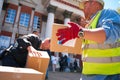 Ukrainian volunteers unloading boxes with humanitarian aid