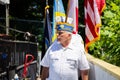 Assignment: Our Ukraine. Ukrainian war veteran with American and Ukrainian flags Royalty Free Stock Photo