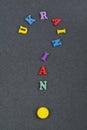 UKRAINIAN word on black board background composed from colorful abc alphabet block wooden letters, copy space for ad