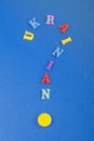 UKRAINIAN word on blue background composed from colorful abc alphabet block wooden letters, copy space for ad text. Learning