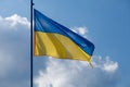 Ukrainian yellow and blue flag on a background of blue sky Royalty Free Stock Photo