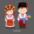 Ukrainians in national dress with a flag.