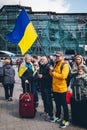 Ukrainians with national flags honor civilians killed in the war in Ukraine.