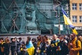 Ukrainians with national flags honor civilians killed in the war in Ukraine.