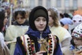 Ukrainians sing Christmas carols as they carry a huge decorated star of Bethlehem and sheaves of wheat in their hands during a