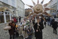 Ukrainians sing Christmas carols as they carry a huge decorated star of Bethlehem and sheaves of wheat in their hands during a