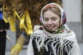 Ukrainians sing Christmas carols as they carry a huge decorated star of Bethlehem and sheaves of wheat in their hands during a