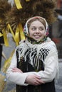 Ukrainians sing Christmas carols as they carry a huge decorated star of Bethlehem and sheaves of wheat in their hands during a