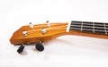 Ukulele close up in white background. Royalty Free Stock Photo
