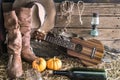 Ukulele with cowboy hat in barn studio Royalty Free Stock Photo