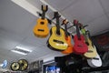 Ukulele and guitars in a musical instrument store