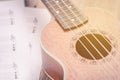 Ukulele and musical paper notes Royalty Free Stock Photo