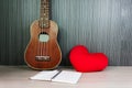 ukulele and red heart with blank note book with pencil Royalty Free Stock Photo