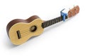 Ukulele and Tuner isolated on white Clipping path included