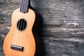 Ukulele with wooden background. Acoustic music instrument. Art a Royalty Free Stock Photo