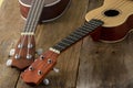 Ukuleles against a wooden background