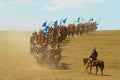 Mongolian horse riders take part in the traditional historical show of Genghis Khan era in Ulaanbaatar, Mongolia. Royalty Free Stock Photo