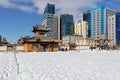 Traditional monastery and building contrast in winter