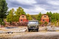 Sleeping dog and four-wheel drive car in the courtyard of the camp site near Uzunkel Lake Royalty Free Stock Photo