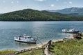 Zmeyevaya bay, Chivyrkuisky bay of Baikal, Russia. Boats bringing tourists to visit thermal spring Royalty Free Stock Photo