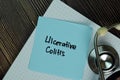 Ulcerative Colitis write on sticky notes isolated on Wooden Table. Medical or Healthcare concept