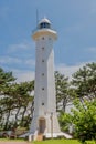 Ulgi lighthouse in front of trees Royalty Free Stock Photo