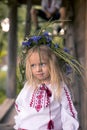 little ukrainian girl in circlet of blue flowers Royalty Free Stock Photo