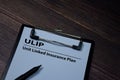 ULIP - Unit Linked Insurance Plan write on paperwork isolated on wooden table Royalty Free Stock Photo