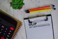 ULIP - Unit Linked Insuranced Plan write on a paperwork isolated on Wooden Table Royalty Free Stock Photo